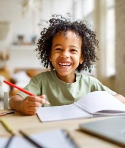 Distance,Education.,Smiling,African,American,Child,Schoolboy,Studying,Online,On